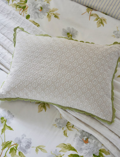 7afbfc1345ab65844a6b303660480235231a28ed17e8ae2bef8e6a47279c6ba7.jpg An Image of Sanderson Linen Rich Adele Embroidered Bolster Cushion