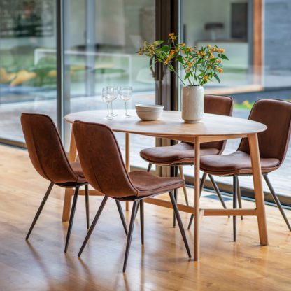 45b192555ff4e55dfb4b19ffcc123b657d5755d2e9679bdea2fc1bebc67a969c.jpg An Image of Hinton Oval Oak Dining Table Light Wood