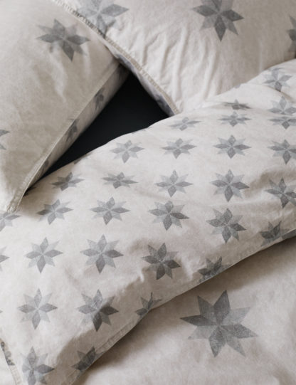 60328404e220b16f73722b33aed5afb9a446f11a1d4247fed776a9c6f48f2b45-1.jpg An Image of M&S X Fired Earth Paris Cabaret Bedding Set