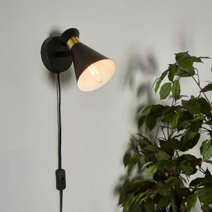 71a584bec34ab1bd1a6462217946555b3b45ee20453d979897177125bcfd910b.jpg An Image of Balham Plug In Wall Light - Black & Brass