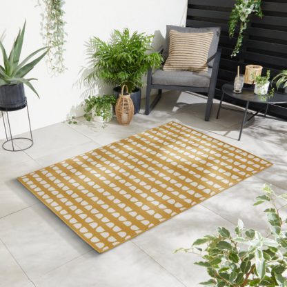 785e66d703c2d2ff6ab68d14c60e78a926e345847f48ff2939ae4ed554d2c86d.jpg An Image of Elements Coastal Indoor Outdoor Rug Yellow/White