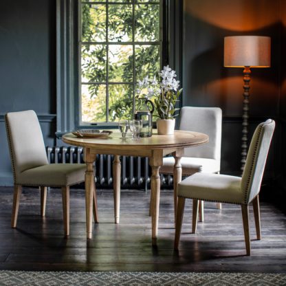 93f19155e99f6b613e83f8d5b3740dfa37c2cf94a27c476192e40d1c7dad3104.jpg An Image of Chester Round Dining Table Natural
