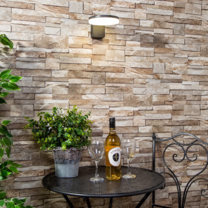 79219d2b9193244ed52cf64bc313e48884383b445d15b8819504c72cf5ed35e0.jpg An Image of Corte 12w Outdoor LED Wall Light (IP65) - Black