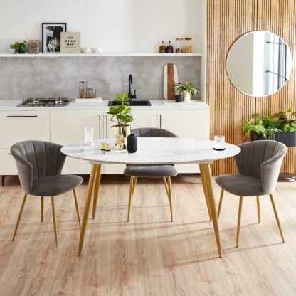 1fbc2c9709cd17b48fd7d05bb66934d647625abe5d5b73486ed9f780b4e50f98.jpg An Image of Kendall Faux Marble Oval Dining Table Black