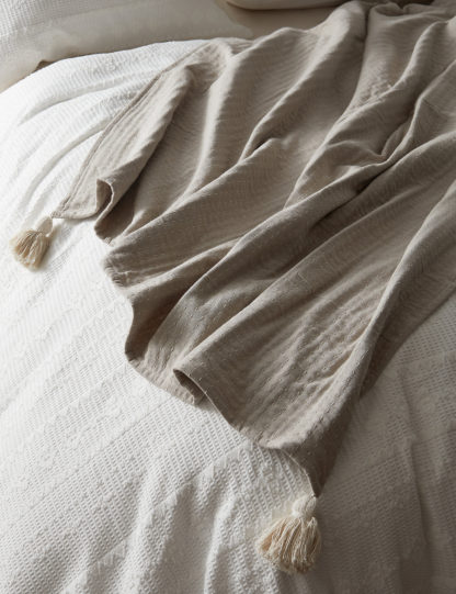 5ead39dd5a39d5d1777f7d14a2bbd6b1559d4121cbe9020cc7393c00edfab181.jpg An Image of M&S Casablanca Collection Maarif Stitched Throw