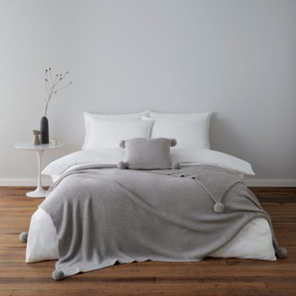 955b57757ab9794c4857b6736db1a83b547030c70fa38994c10e2fa3ff1c9155.jpg An Image of Pom Pom Knit Grey Throw Grey