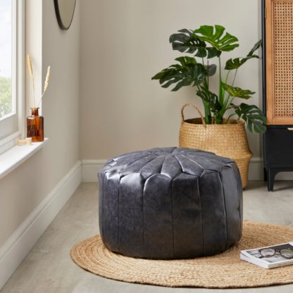 cf2c2f82ed151cd819e6b2b3100e3e1d318398f4549c7e12d206c09023e95f19.jpg An Image of Moroccan Pouffe Black Black
