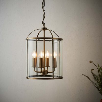ed6bf0ff6bd91bda8b7360a1f4ab91d06a0e0f716eae2d7e429e8f5cdb5215ef.jpg An Image of Abott 4 Light Pendant Light - Brass