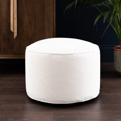 f63fd44a0af1b3d77db6c3bef59e06dff91d149077867c5112b6fb88f054680a.jpg An Image of Eliza Velvet Pouffe Cream