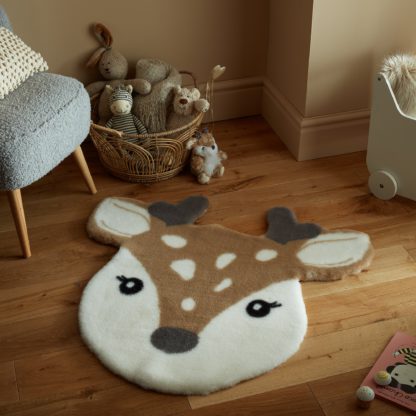 fbf290cb7cbc8e0c0f47ba53b6da44330769e54d9392008dc1a612da96a70a26.jpg An Image of Darcie the Deer Rug Brown with White (Brown)