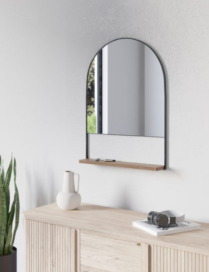 1f1444a9b6b9025575aeb2657ed9df0846be642606c4d5005609c156707e078e.jpg An Image of M&S Milan Medium Curved Mirror with Shelf