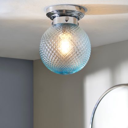 65d084207a2c6b2be5ed2425face926f0ba45f036b510f53ad599b783b4ef1aa.jpg An Image of Tropic Bathoom Faceted Sphere 1 Light Flush Ceiling Fitting Clear