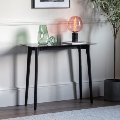 b80bf5e96974f79e92916dedccff26c63a7a550347e3fe63b1c854485a300923.jpg An Image of Brea Console Table, Glass Black