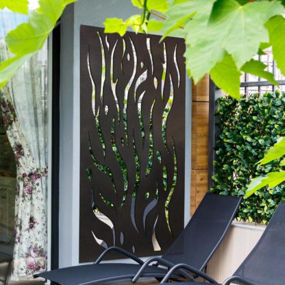 c777884e4ccd15eceda1a2330efdab5e77c44e7973054372436398d28e6bb0e8.jpg An Image of Amarelle Extra Large Metal Flame Decorative Garden Screen Mirror - 180 x 90cm