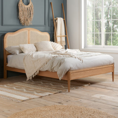 43f07e15965a427c3c1609fd5bf6456f7b856f69fdd649e0da9bc56eeca54f38.jpg An Image of Leonie Rattan Oak Wooden Bed Frame - 4FT6 Double