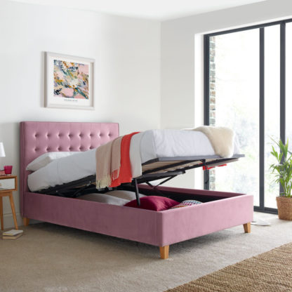 47ede3bc6f9e05e4f3a4c839a3bea59cdc012e13fcb8bc9a6f0835fb825b574e-1.jpg An Image of Kingham Pink Velvet Fabric Ottoman Storage Bed Frame - 4ft6 Double