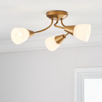 5c05fafd6d9e54b7de25bf0484ab9f4308eb4069928b886c0e976913cbad7c99.jpg An Image of Ordway Frosted 3 Light Ceiling Fitting Antique Brass