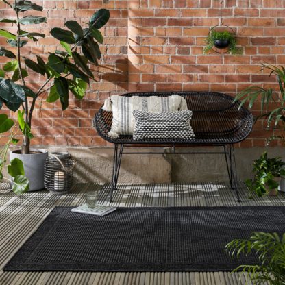 16346aece2438c8f393bb87bc6519a98a3c5d21e6a06830a8e0440fcda10f883.jpg An Image of Twill Jute Look Indoor Outdoor Black Rug Black