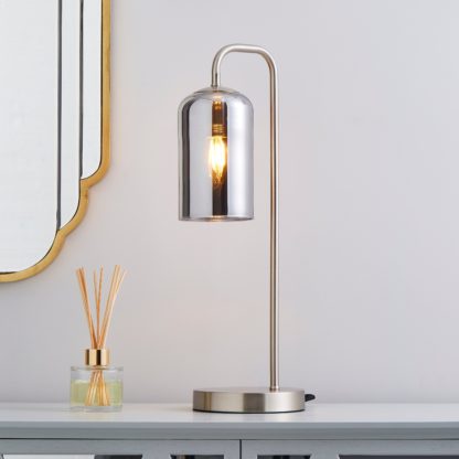 64ba8129b76b8fd64349a6c6dc6f417814bee4a8154d5d489223578a6f906f52.jpg An Image of Palazzo Smoked Glass Table Lamp Satin Nickel