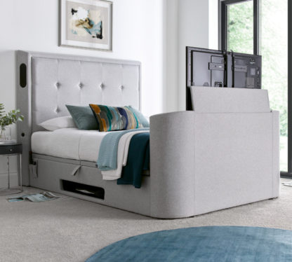 79dba9ca5ce25fa55159ccf386f43ba0676ac5a650b86213b6ac86e567472036.jpg An Image of Monaco - Double - Electric Media TV Bed - Light Grey - Fabric - 4ft6