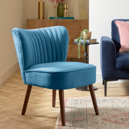 88fe2d913795a485a3aec70d23a958be0e6f73de3b2f6e724663cdffa6d37c7b.jpg An Image of Camille Velvet Cocktail Chair Camille Mineral Blue
