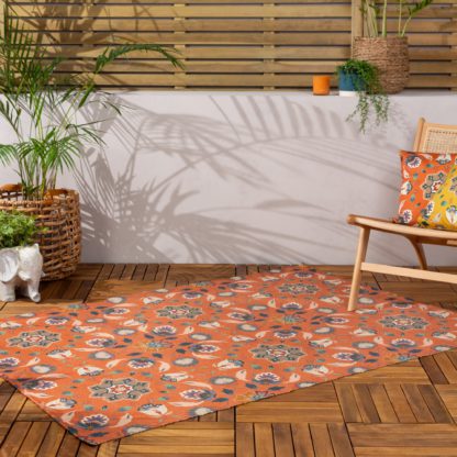 00e685a6c4d58bc18ad3b44d16a6997c9d428a8db18e53d620d7c1d19372725d.jpg An Image of furn. Folk Flora Orange Washable Indoor Outdoor Rug Orange