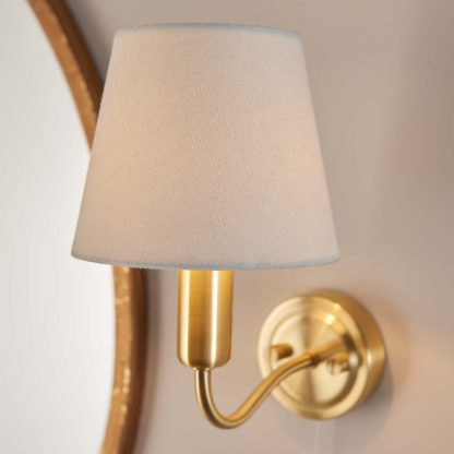 d82bd251da93b2b17cb2dc34f4cc27715c3f510b68bee1a2ca4df08840dad04b.jpg An Image of Naim Bathroom Wall Light - Brass Effect