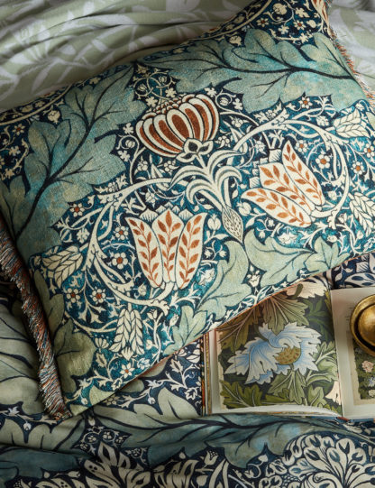 e52c6d4e97c9cbf528d65f75ad927e9f67dffbcff2d8d66f8f63ff52d1d23f6b.jpg An Image of William Morris At Home Velvet Avon Chintz Bolster Cushion