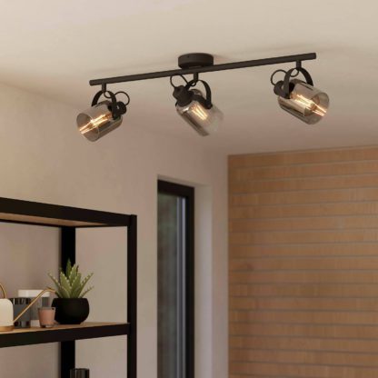 e961505f2dfd3f72dcd458b68bb1133ef64e76e33f7b2ab2f9368ffd5d7bc3f0.jpg An Image of Eglo Berregas 3 Lamp Spotlight - Black & Transparent