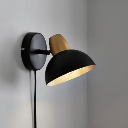 48015bad0783c9ab44137dfba04e14704b8b8355c8df5a1ddbbb57894fd057d1.jpg An Image of Haus Easy Fit Plug In Wall Light Black