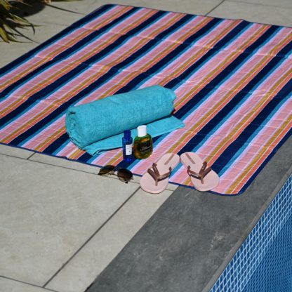 7c8c099444729c39aac0c59b4e9272ee70fb0aec6522a27a01f2eae05b5e5580.jpg An Image of Riviera Stripe Picnic Blanket MultiColoured