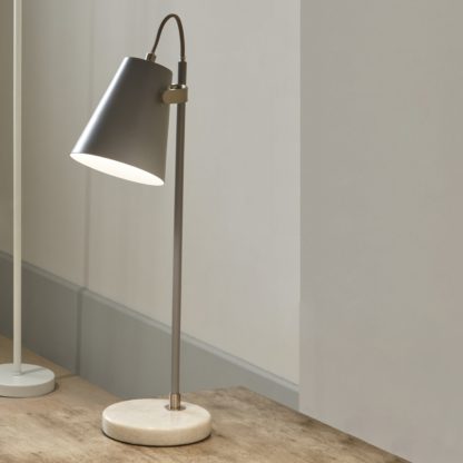 841c4a00217b5e53d31254d9ecf22cc7494f61866dc6c6011656300a6093fd6b.jpg An Image of Theia Task Table Lamp Grey