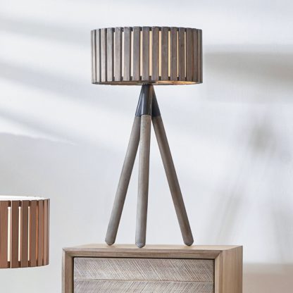 dece5ba3085e5b575276359ca2ceb905b09059523fc72afae62572afc8fba2ed.jpg An Image of Rabanne Wooden Slat Tripod Table Lamp Grey