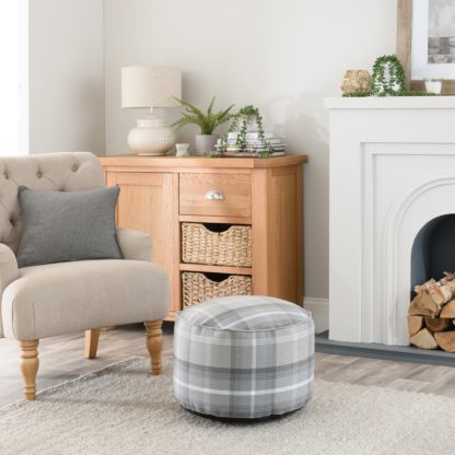 4e29905062b647baf4382e8ba0c249747eae2e7bd63222141647e6e8ec8e29ec.jpg An Image of Oswald Check Pouffe Grey