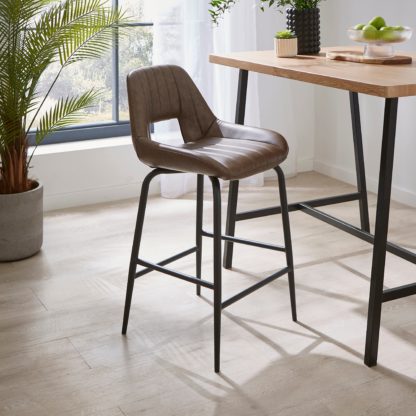 00512cee7216f969d9066cba3a75f6fcf5dec2b09bf591eeaa9faf877ec9b5fa.jpg An Image of Arden Bar Stool, Faux Leather Brown