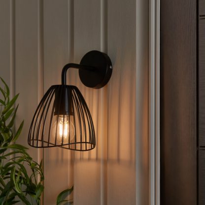 3050c4ad59a63aa3b7eea04e2689e50b4c4a6bcfe6be0dc2c5a66dbbeb656894.jpg An Image of Jaula Indoor Outdoor Wall Light Black