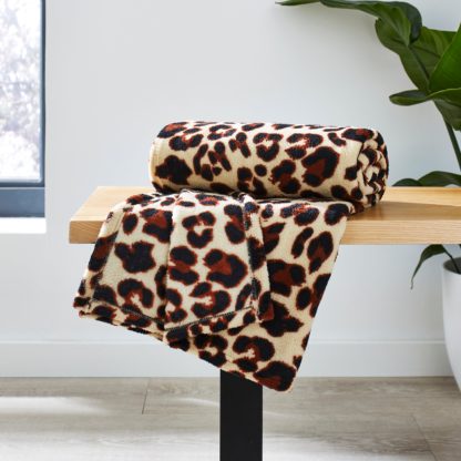 5f5892041db12a8aff34f8d912b8306f20f3a916b0baa254643a623a5c3c23ff.jpg An Image of Animal Print Fleece Throw, 130cm x 160cm Brown