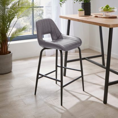 7afdd153fcdc78acca0c10cb918c3e55b6aa437b66372704fbd2b039990373b9.jpg An Image of Arden Bar Stool, Faux Leather Brown