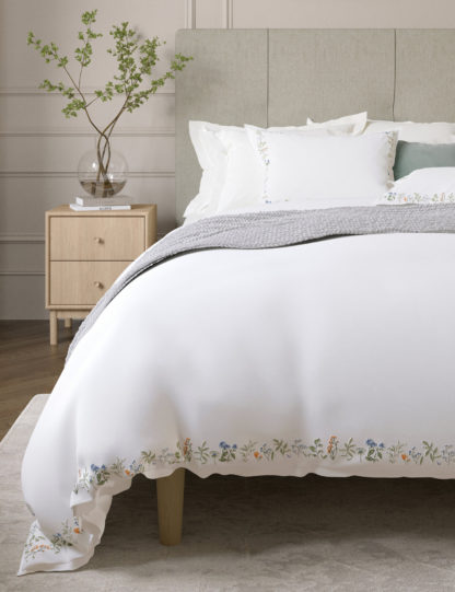 d0b8649d680cd98acc0fbda53c6bcdef5a05d451a3818d950823db9ae0e930d9.jpg An Image of M&S Wild Primrose Sateen Embroidered Bedding Set