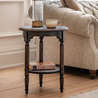 5720d166981379a77a7480e9f3e97548725c5d2b700564b71143f8df612b5e7f.jpg An Image of Matola Dark Wood Side Table Matola Brown