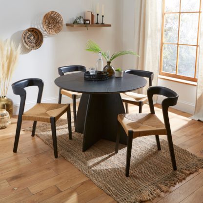 7142addf2c8489e02e145b6c681d9828454b81a12063da063388f0e7903aafc4.jpg An Image of Effy 4 Seater Round Dining Table Black