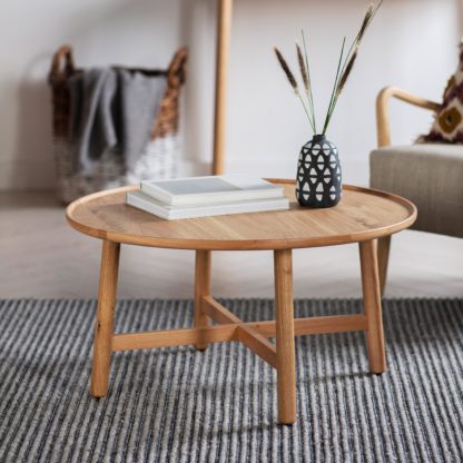 0af0bdb257b8c079b2fd3918e2d5dbf990a883e31285d6dbd6e25cae23a218c4.jpg An Image of Kalia Round Coffee Table Grey