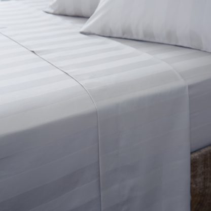 2652c02dae2aea44feb082a6d2fa84a722b23766d4b073835045ddc1cd705aab.jpg An Image of Hotel Cotton 230 Thread Count White Stripe Flat Sheet White