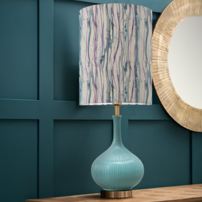 7134a7f182abd2859e74b0e40bd0e35097cdfd050b303b43191548033de7d381.jpg An Image of Ursula Table Lamp with Falls Shade Falls Indigo Blue