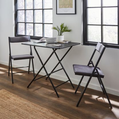 96947f1a5128e554f6485a8b011b6aad929b5fa3b204f91424fb5faa58f0b568.jpg An Image of Freddie Folding Table Rustic Oak Effect