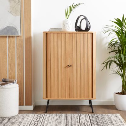 1d05cd3092bd528143d4a606f4619c1ad7747c545fa6782d12e500f5209126c9.jpg An Image of Hansen Slatted Tall Sideboard Oak