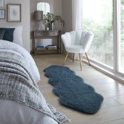 54004408dcfbac047ed08c5b409d64e21a58a455598396bbf019c3f0f70d954c.jpg An Image of Whistler Faux Fur Quad Pelt Rug Pacific Blue