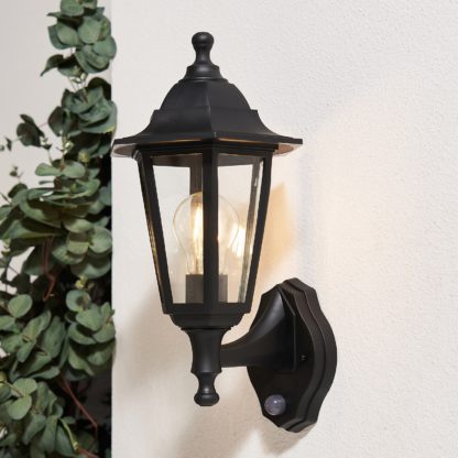 6e1c2867ba5c02560ea8ca13f0266b0a38b4c4812c721ccaa3cc87654cbc58f8.jpg An Image of Rutland Outdoor Wall Lantern with PIR Motion Sensor - Black