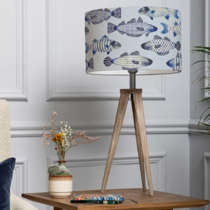6ef95dd4ec532ca553fdbc55b7abb685d06fc37db77d8131e2468a6f6bfe2492.jpg An Image of Aratus Tripod Table Lamp with Cove Shade Cobalt Blue