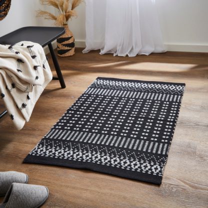 a484cd00ebc28a8bd9ebba53bedb40a5c98358fc36a3af34b49245969b52991f.jpg An Image of Woven Washable Rug Green